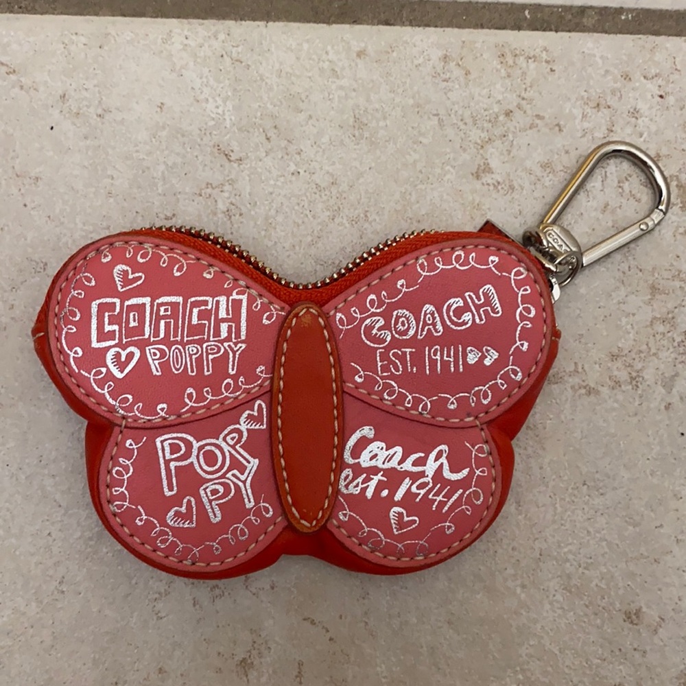 Small butterfly coach change purse.